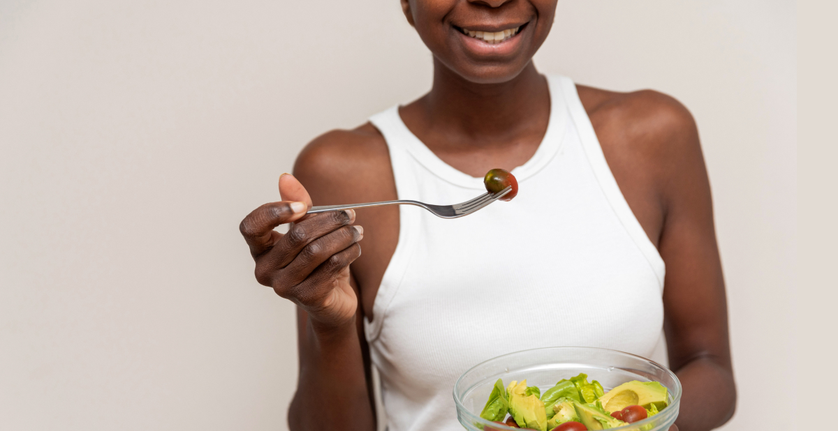 woman eating salad for healthy skin diet