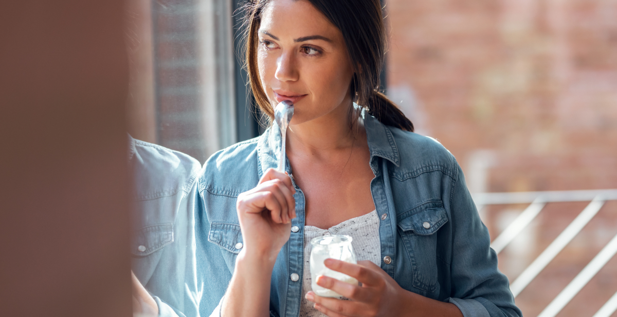Woman eating yogurt